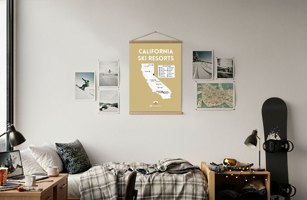 Room interior with a map of California ski resorts on the wall, surrounded by framed photos and a snowboard.