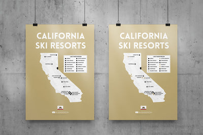 Two posters of California ski resorts on a concrete wall.