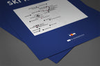 Blue colorado poster with ski resorts on a gray table