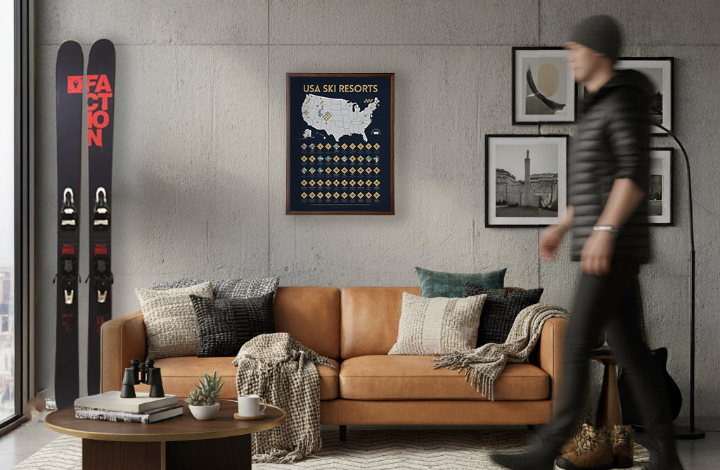 Living room with brown leather sofa, ski poster, and skis against wall