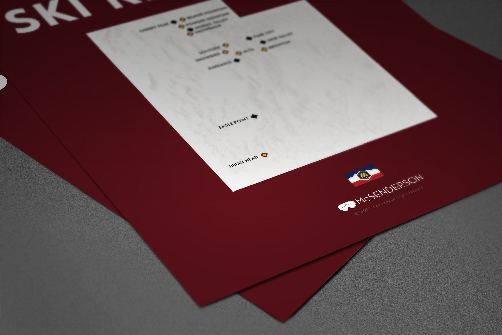 Utah ski resorts map on a red background on a gray table