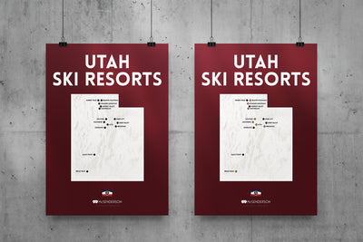 Two posters titled 'Utah Ski Resorts' hanging on a concrete wall.